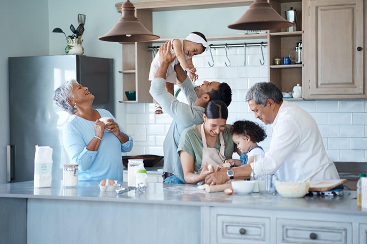 Multigenerational family baking together in the kitchen.